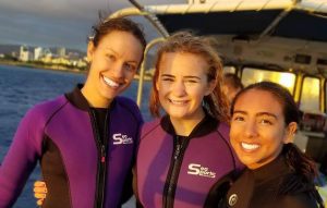 three girls on the dive boat